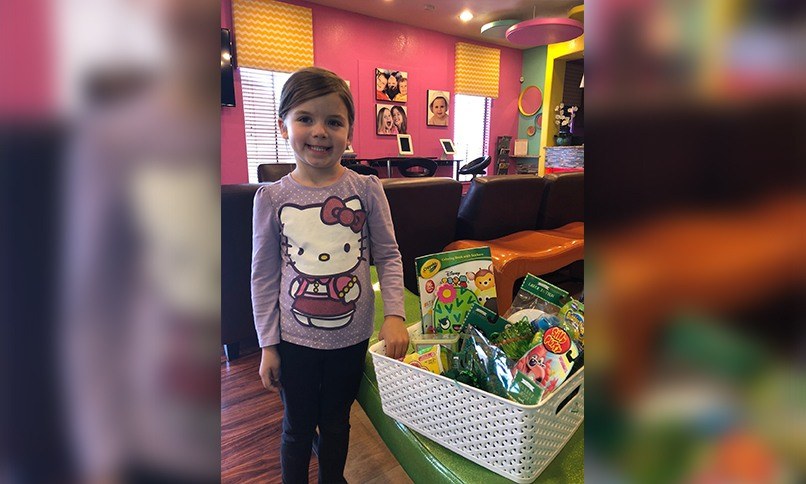 Child choosing toy in dental office