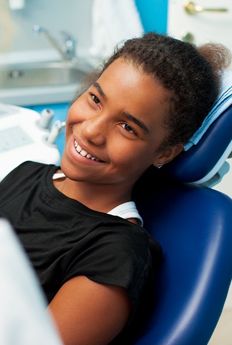 Young girl smiling after cosmetic dentistry treatment