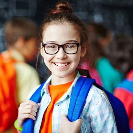 Girl with backpack at school in Wylie