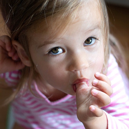 A little girl sucking her thumb in Wylie