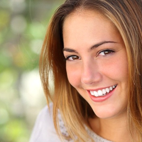 Female smiling after dentist in Wylie