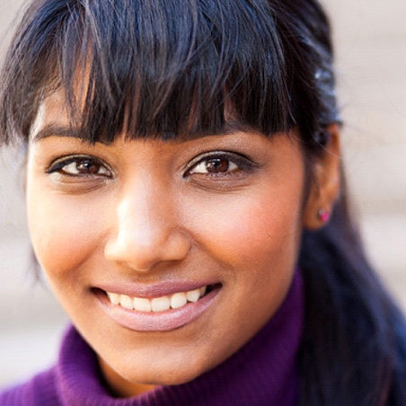 Female with dental crowns in Wylie