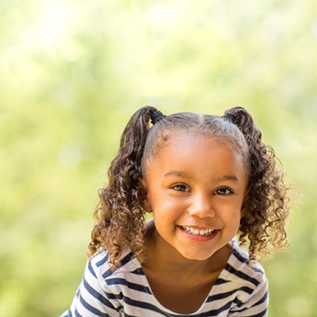 Girl smiling with dental sealants in Wylie