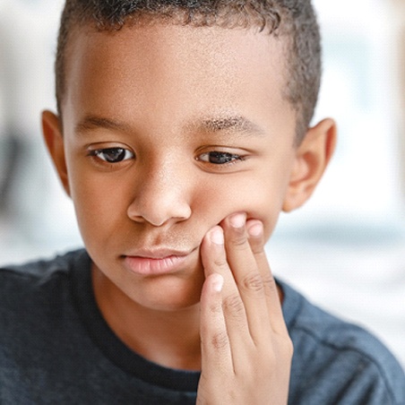 Boy experiencing tooth pain in Wylie