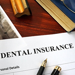 a dental insurance form on a table