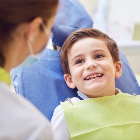 Young boy receiving dental checkup to prevent dental emergencies