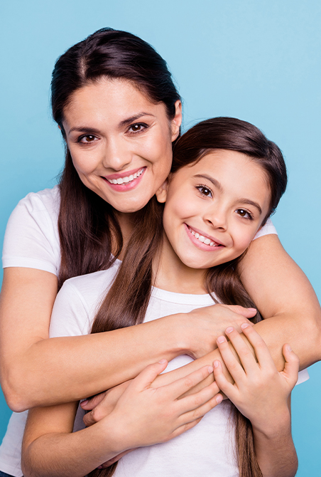 Mother and child smiling after dental office visit