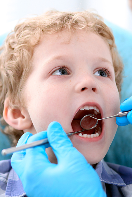 Young boy in dental office for his first pediatric dental visit