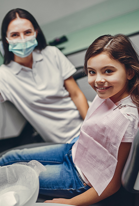 Dental patient and mother in dental treatment room