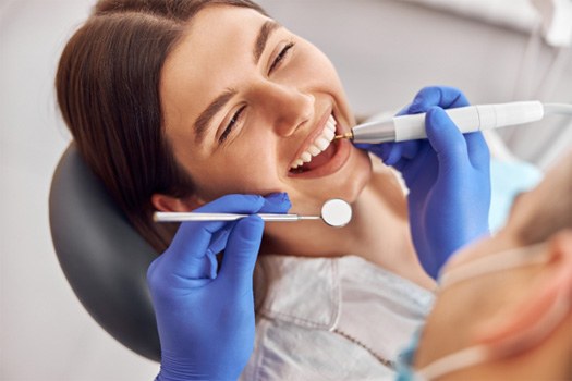 Woman getting her teeth cleaned