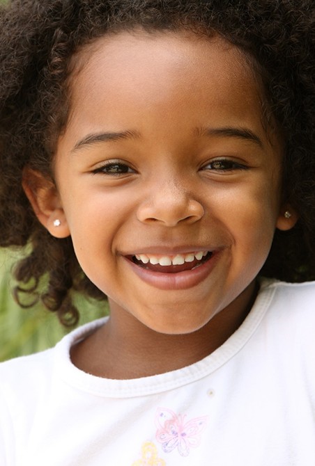 Little girl enjoying healthy smile thanks to dental sealants in Wylie