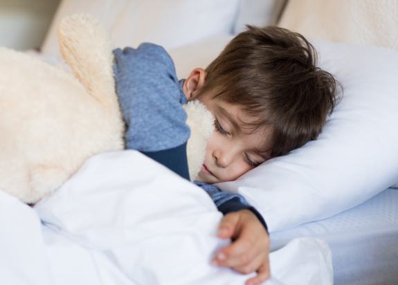 Little boy resting after pediatric sedation dentistry visit