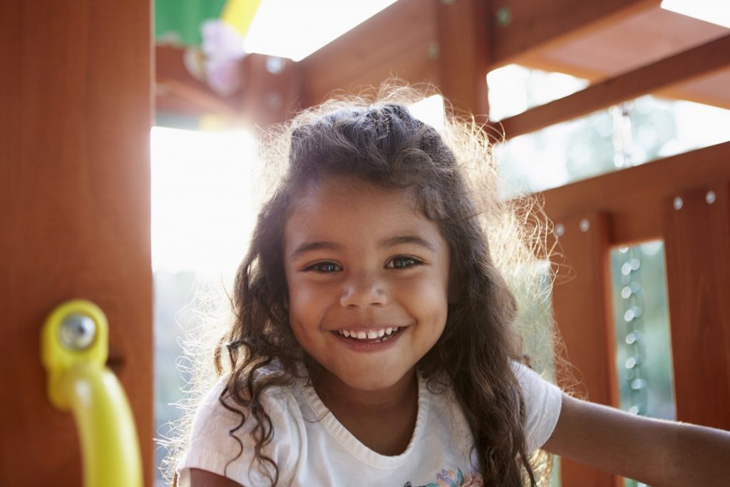 Closeup of child smiling on playground