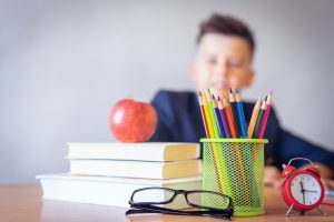 Young boy sitting at school desk