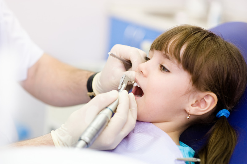 Young patient getting pulp therapy