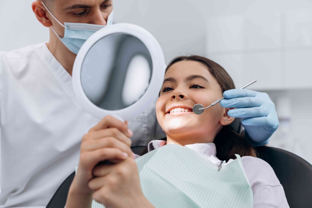 Teen smiling at the dentist