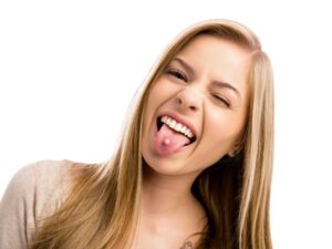 A teen with a tongue piercing